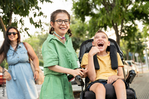 Cheerful family enjoying outdoor activities with special needs children