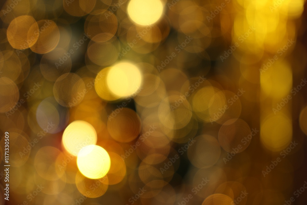 Fototapeta premium Blurred view of shiny golden lights as background. Bokeh effect