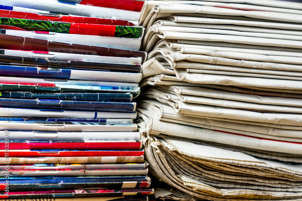 Many newspapers and colorful magazines spines Many newspapers and colorful magazines spines