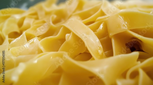 Messy and creamy buttered noodles with rich texture.