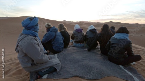 Obraz na płótnie Africa, Morocco, Merzouga 5,1,2025
tourists visit and take an adventurous trip to the Sahara desert with a Berber guide they go to the sand dunes desert riding camels , looking sunrise morning time w salonie