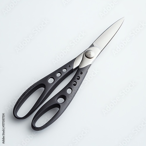 Black handled scissors on a white isolated background. photo