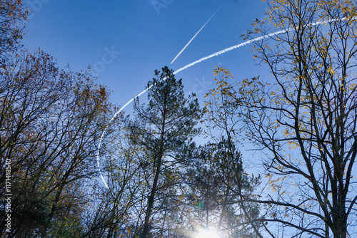 Vortex smoke trails from French military jet aircraft performing fast aerial manoeuvres over the Dordogne countryside
 photo