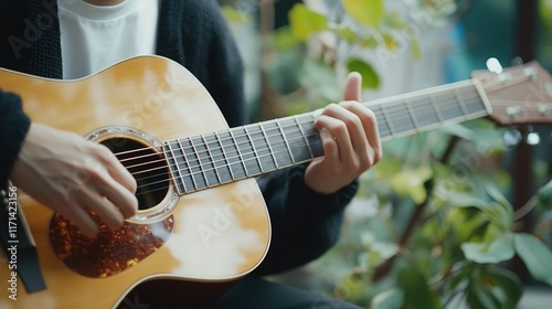 Close-up of a Musician's Hands Playing Acoustic Guitar