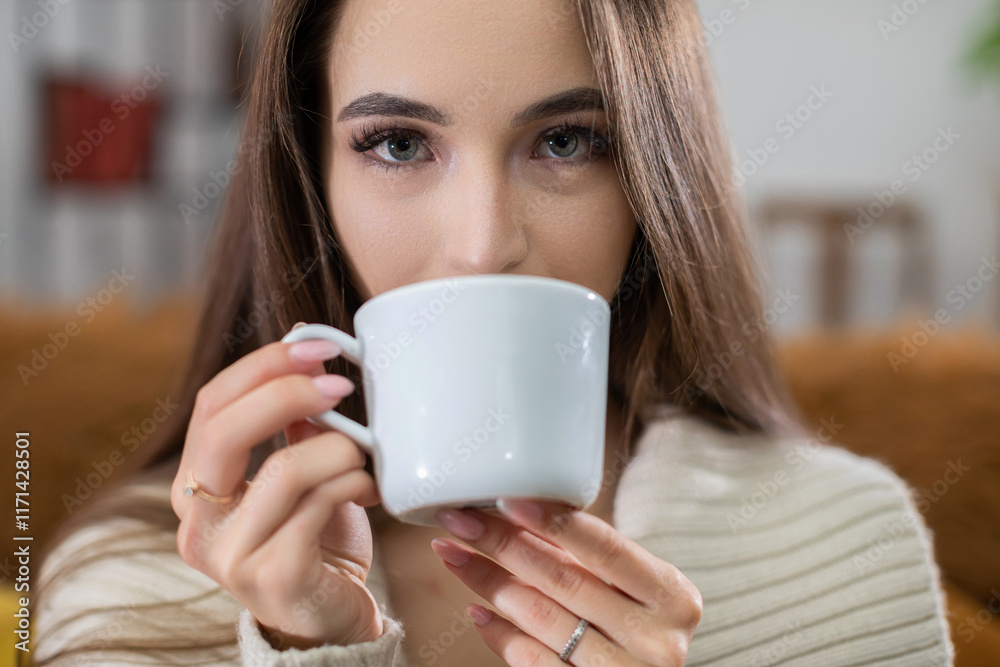 Cozy Moment A Young Woman Finding Joy and Relaxation While Enjoying a Cup of Coffee at Home Cozy Moment A Young Woman Finding Joy and Relaxation While Enjoying a Cup of Coffee at Home