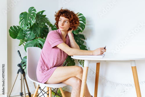 Bild auf Leinwand homeschooling, woman writing notes in notebook
