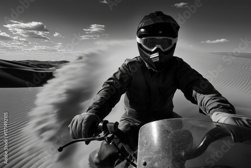 Desert biker conquering golden sand dunes under vibrant blue skies during an exhilarating rally adventure