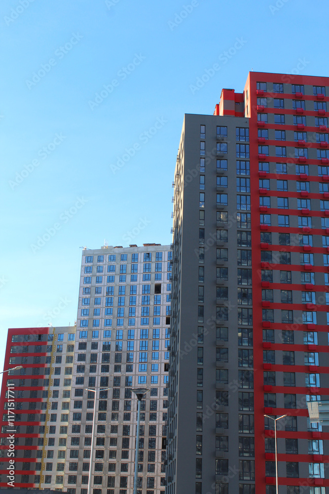 Naklejka premium modern new buildings, apartment buildings and offices in the city, skyscrapers
