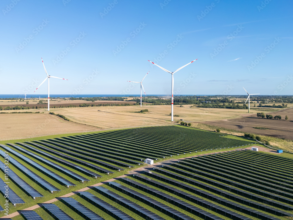 Wind and solar park turbine renewable energy power aerial view photo at the Baltic Sea near Heiligenhafen, Germany