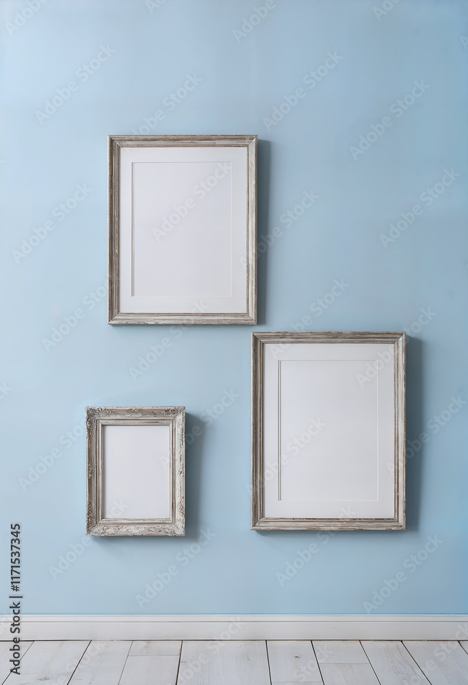 empty picture frames on blue wall