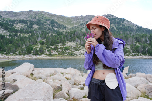 Woman Enjoying Nature with Ostomy in Tranquil Mountain Setting photo