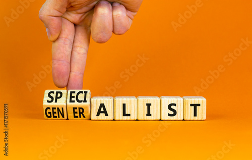 Specialist or globalist symbol. Concept words Specialist Globalist on beautiful wooden blocks. Beautiful orange background. Doctor hand. Business specialist or globalist concept. Copy space