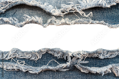 Hole in denim on a white background. Ripped jeans