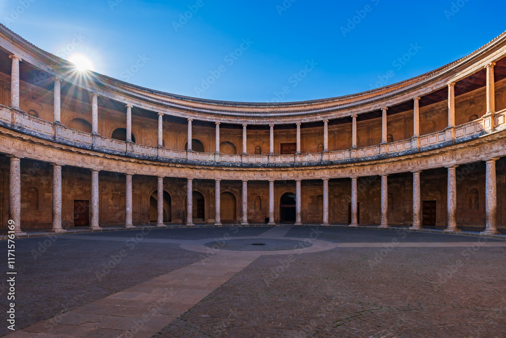 Fototapeta premium Enormous circular interior courtyard surrounded by columns in the Palace of Charles V in the Alhambra monumental complex, Granada.