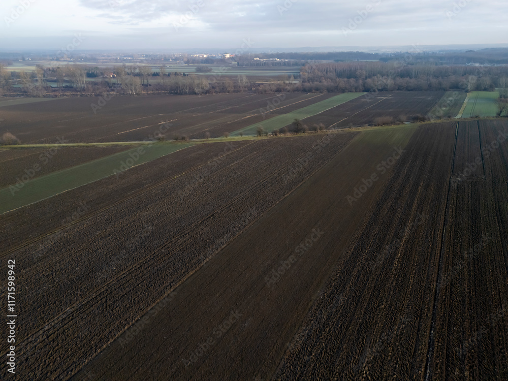 Aerial view of vast agricultural fields with rich textures and patterns, showcasing the beauty of rural landscape Aerial view of vast agricultural fields with rich textures and patterns, showcasing the beauty of rural landscape