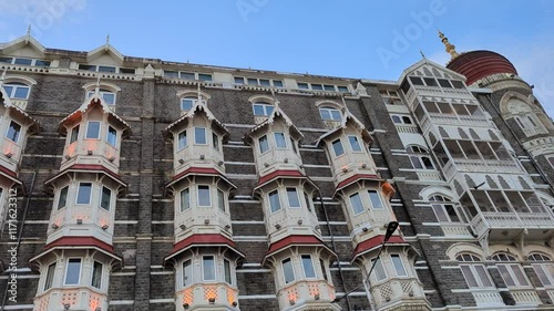 Taj Mahal Palace Architecture with Birds Soaring in the Sky in Mumbai, India photo