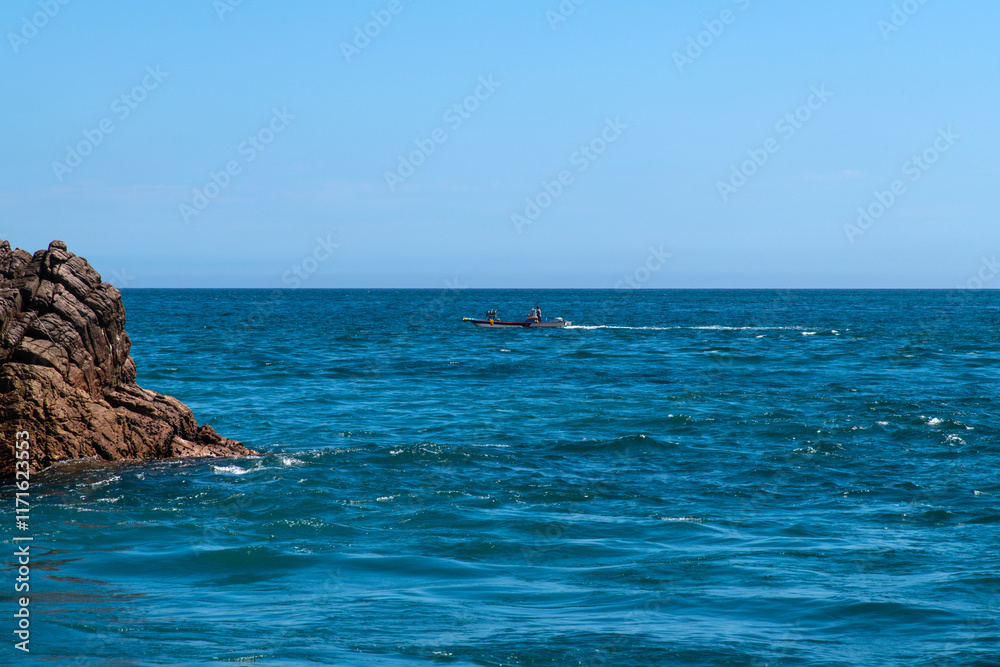 Fototapeta premium fishing boat and cliff at the seaside