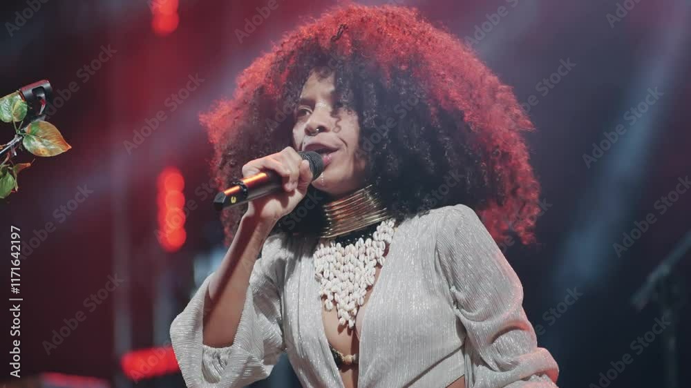 Singer Performing Live on Stage with Expressive Gestures and Passionate Emotions