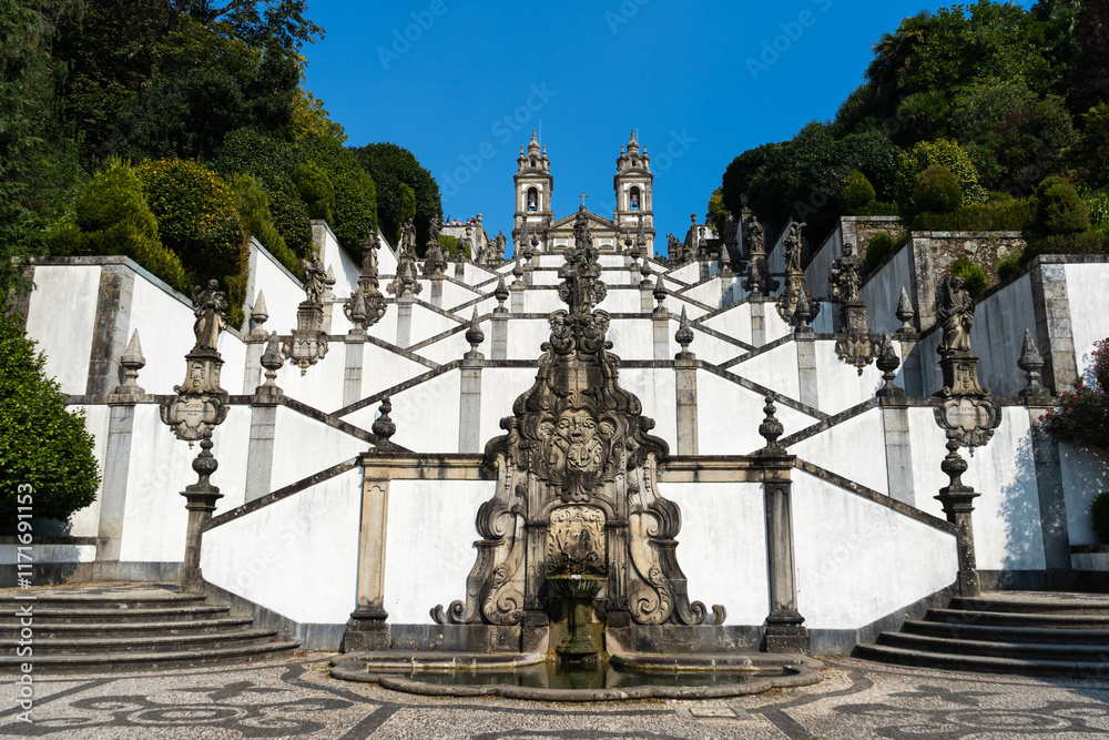 Fototapeta premium Sanctuary of Bom Jesus do Monte on Sunny Day. Stairway and Church. Green Trees. Braga, Portugal