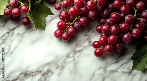 Fresh red grapes arranged on a marble surface ready for snacking or culinary use