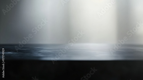 Dark moody tabletop with soft light background
