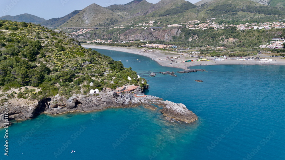 Naklejka premium Spectacular aerial view of Dino's island of Praia a Mara city with blue and transparent sea on summer time lights