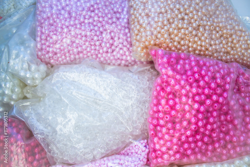 pile of pink and white plastic bags for sale in the market photo