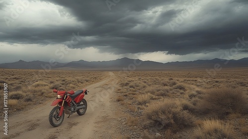 Red dual-sport motorcycle on desert road under stormy sky.
