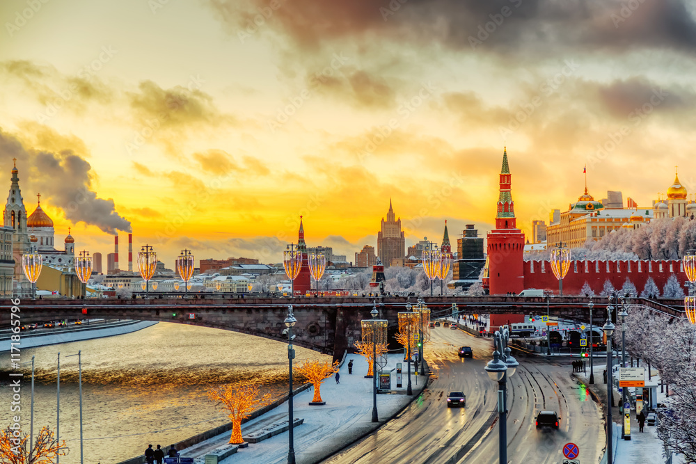 Fototapeta premium Beautiful sunset over the Moscow River, Cathedral of Christ the Saviour and embankment of the Kremlin. Winter colorful sunset in Moscow, Russia.