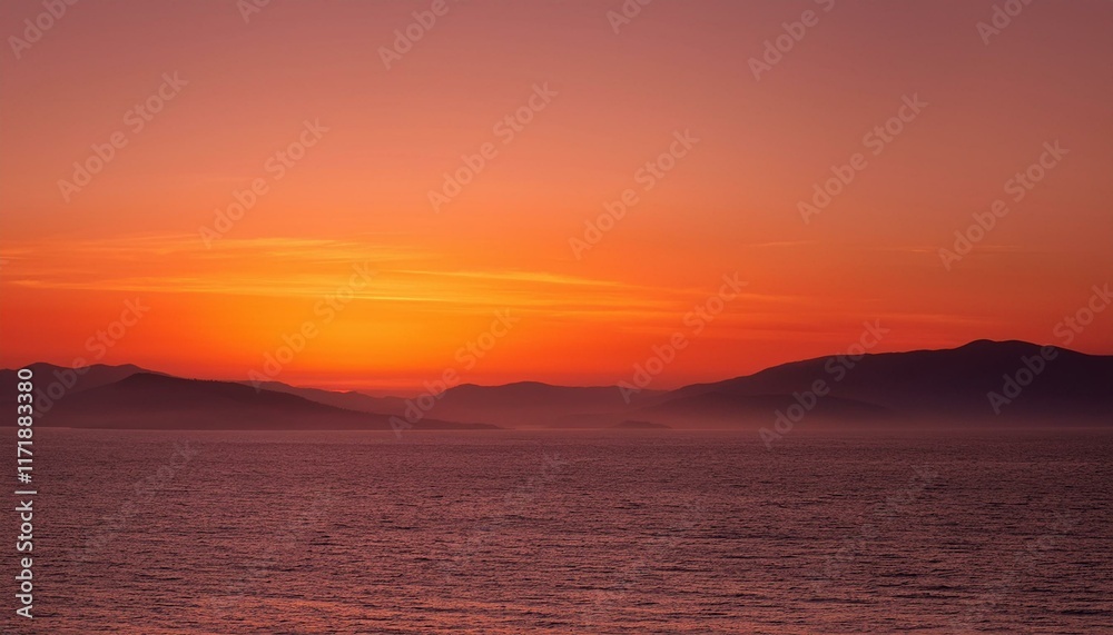 Fiery sunset over calm ocean and distant mountains. A breathtaking view of nature's beauty. Fiery sunset over calm ocean and distant mountains. A breathtaking view of nature's beauty.
