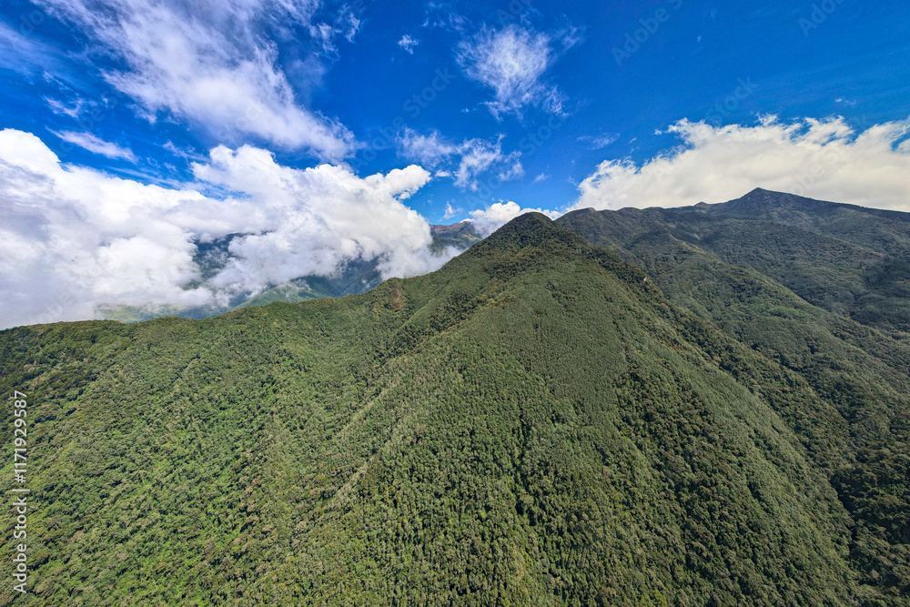 Green Mountains Surrounded by Crops on a Slightly Cloudy Day in Salento, Quindío, Colombia