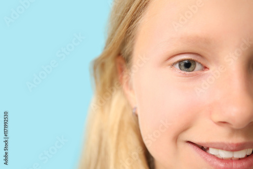 Teenage girl on blue backgr...