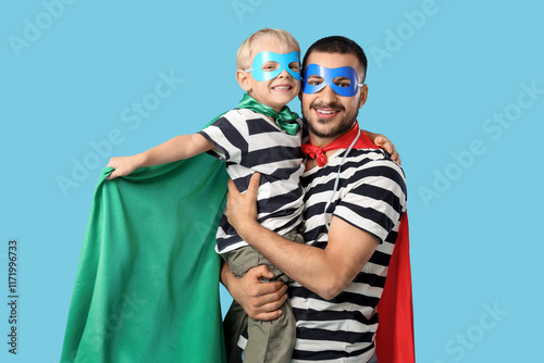 Happy father hugging his li...