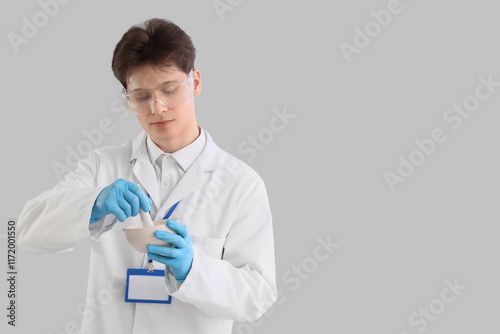 Male chemist with mortar an...