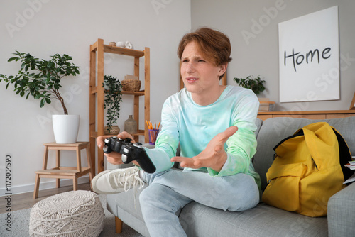 Upset male student playing ...