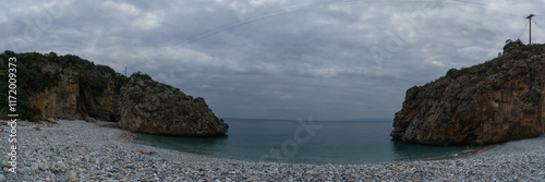 Panoramic view of famous rocky beach Foneas near Kardamyli village with turquoise colored water in spring time, Messinia, Peloponnese, Greece