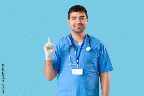 Male doctor with raised ind...