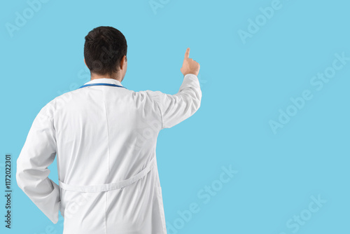 Male doctor pointing at som...