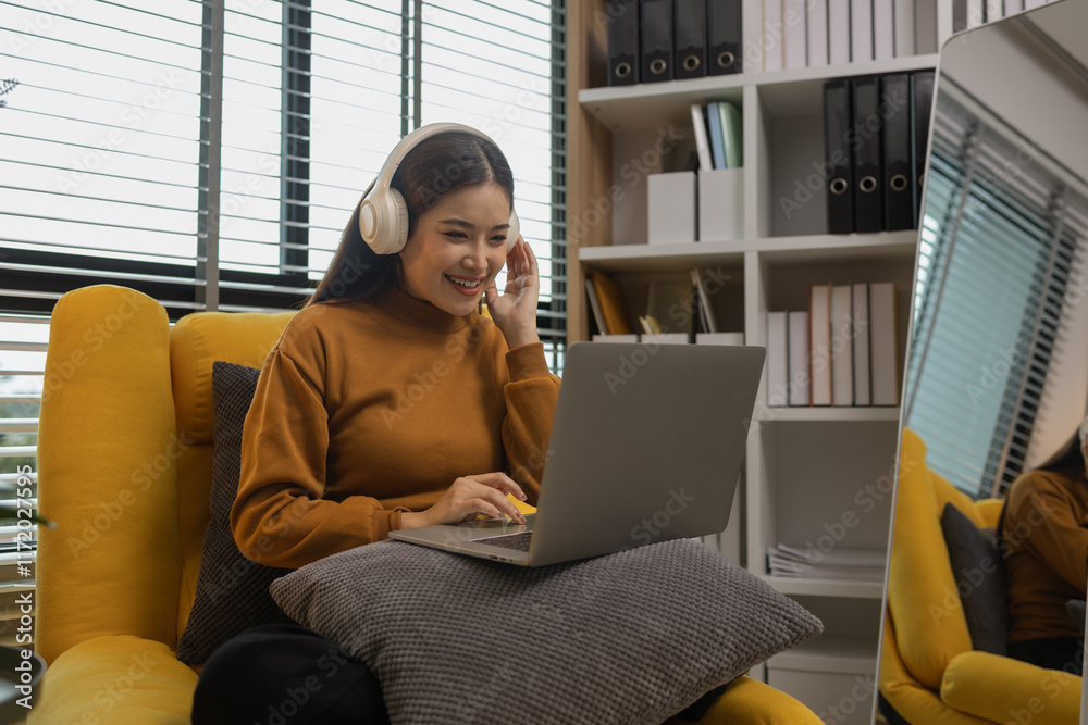 Naklejka premium happy and comfortable at home in the morning, young woman relaxing at home, girl resting in her room, enjoy life, rest, relaxation, wellbeing, lifestyle,