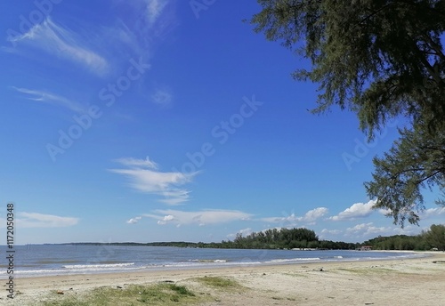 Bagan Lalang beach Selangor Malaysia ,beautiful beach suitable for camping ,swimming and picnic. Cloudy and blue sky background