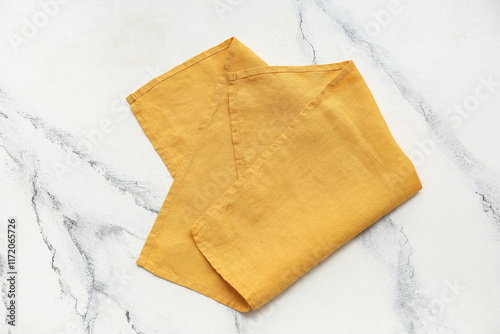 Obraz na płótnie Yellow napkin on white grunge background