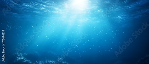 Underwater scene with sunbeams and particles.