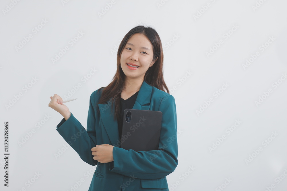 Attractive elegant young asian business woman using digital tablet standing on isolated background. Happy young latin female formal black suit holding tablet gadget working service with customer Attractive elegant young asian business woman using digital tablet standing on isolated background. Happy young latin female formal black suit holding tablet gadget working service with customer