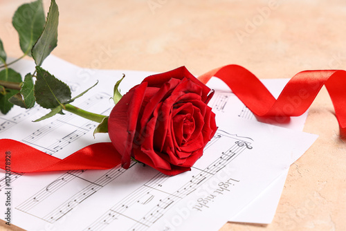 Red rose with ribbon and no...