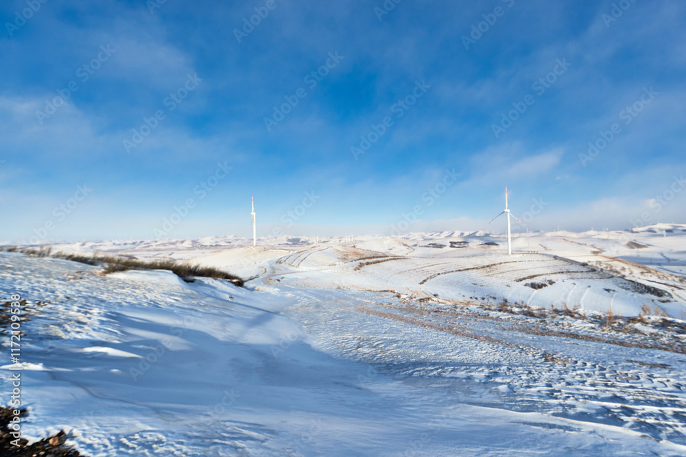 Fototapeta premium Winter grassland sky road scenery in Zhangjiakou, Hebei Province, China