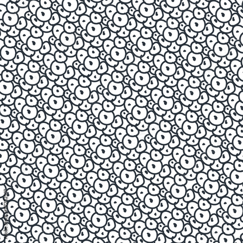 An imitation of a cluster of eggs, or it could be a surface consisting of biological cells with nuclei.