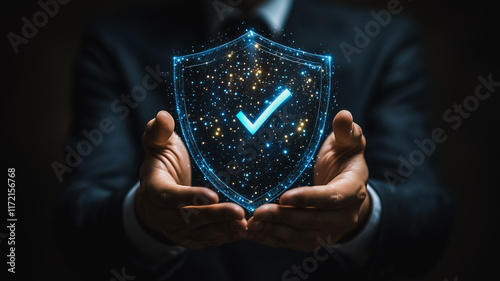 Secure Future:  A businessman's hands gently cradle a glowing shield, its blue digital checkmark symbolizing guaranteed protection and peace of mind.