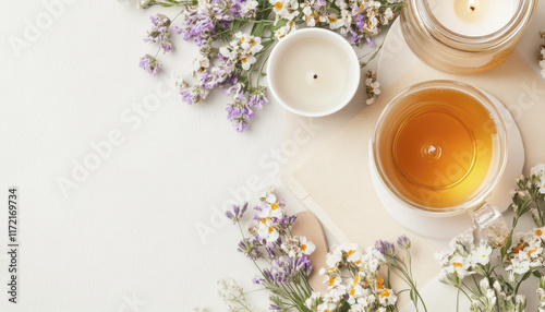 flat lay of herbal tea, candles, and fresh flowers creates calming atmosphere. This serene setup invites relaxation and mindfulness, perfect for self care moments photo