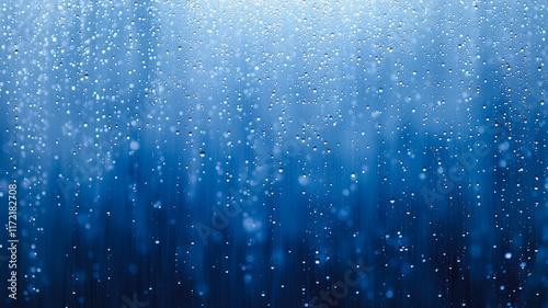 Blue Rain Abstract: An ethereal image of falling blue rain, creating a dreamy and serene atmosphere. Perfect for projects needing a calming, mystical, or watery feel. 