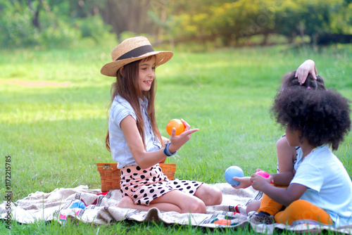 Girls of different nationalities play together in a public park, diverse nation children playing together concept photo